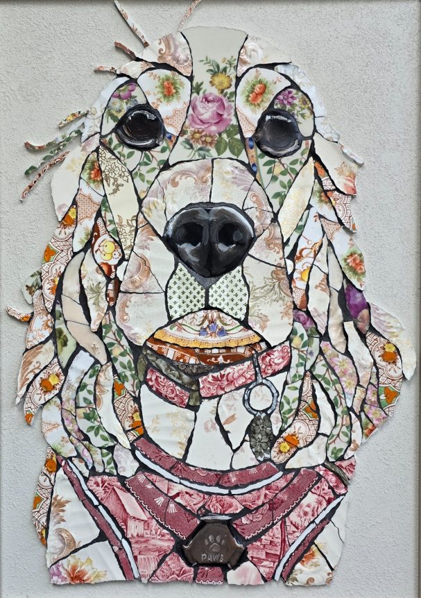 “Handmade mosaic portrait of a Cocker Spaniel created from individually hand‑cut vintage china plates in soft neutral tones.”